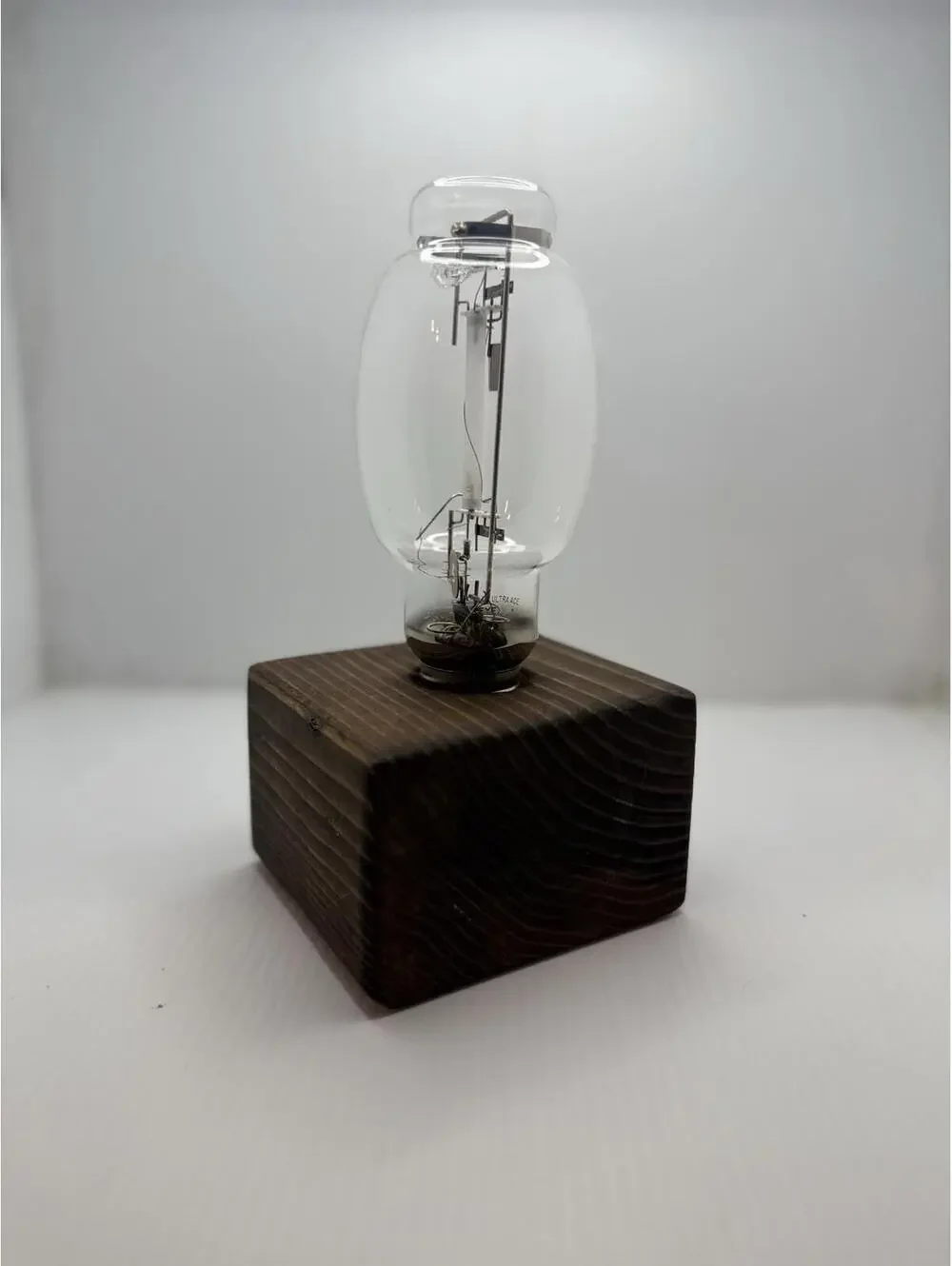 Vintage Retro High Pressure Sodium Industrial Bulb Display on Wood Pedestal